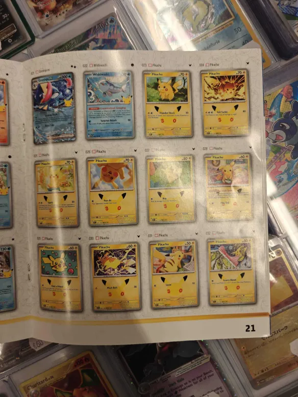 Leaked 30th Celebration set list booklet page 21 filled with Pikachu reprints alongside Greninja and Wishiwashi