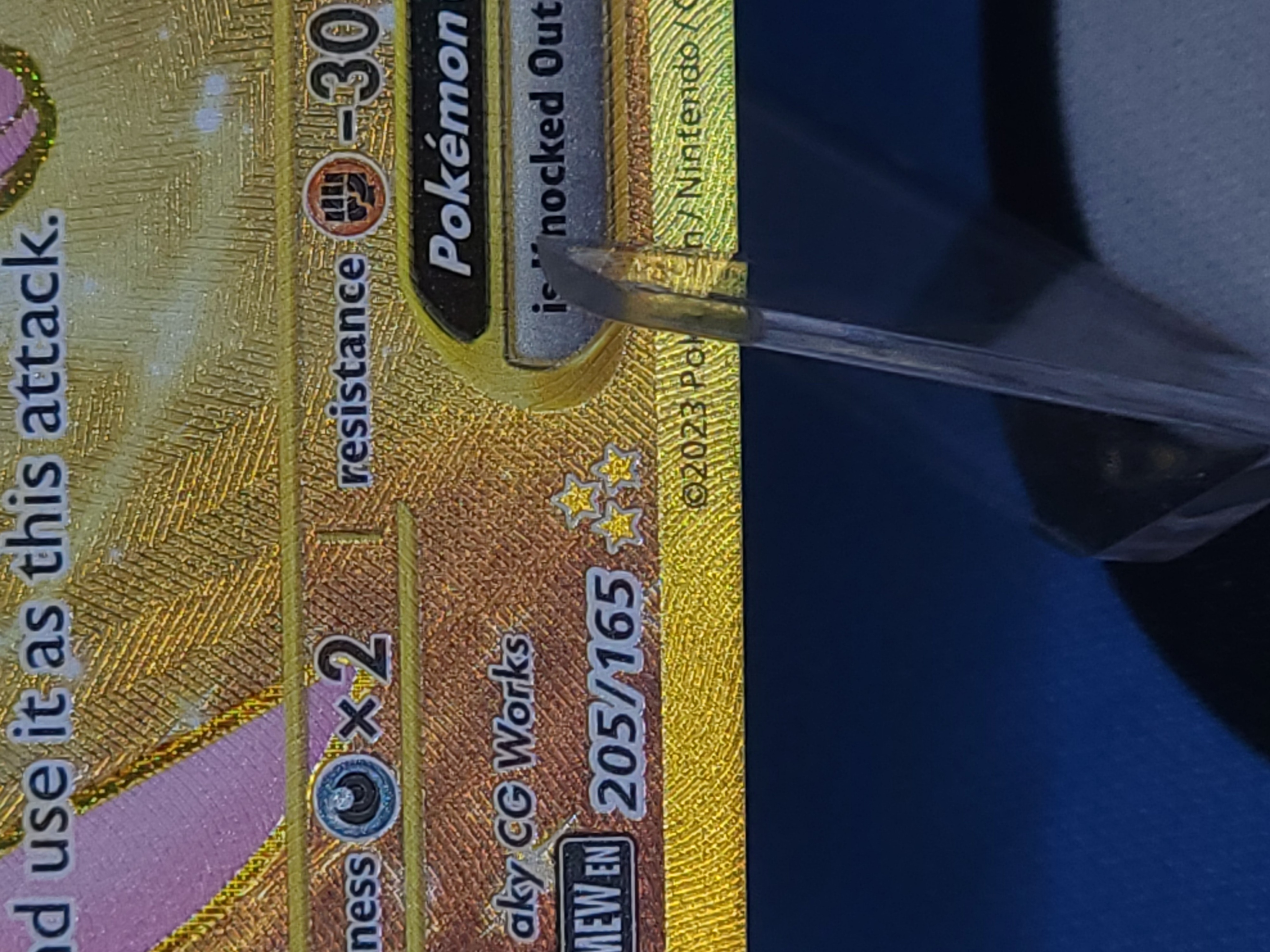 Hyper Rare card showing three gold stars with gold textured foil treatment