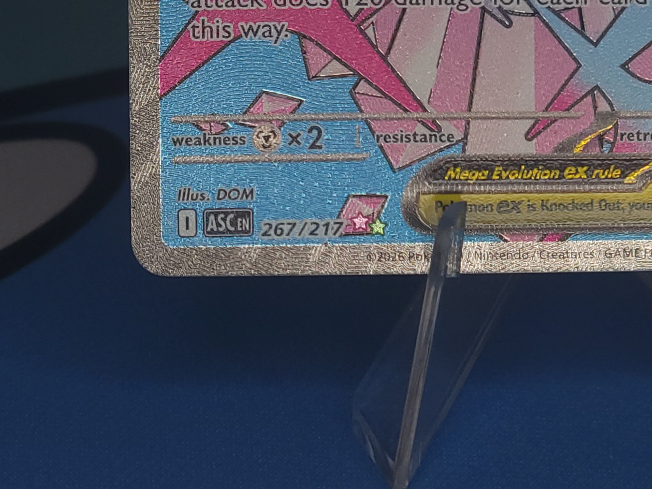 Mega Attack Rare card showing the pink and lime-green side-by-side star rarity symbol with attack-text artwork design