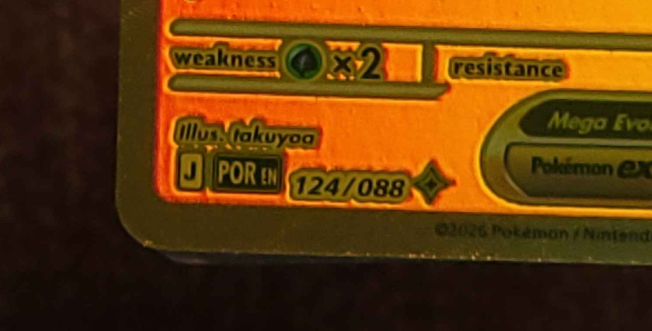 Mega Hyper Rare card showing the gold-and-black burst-style rarity symbol specific to the Mega Evolution era